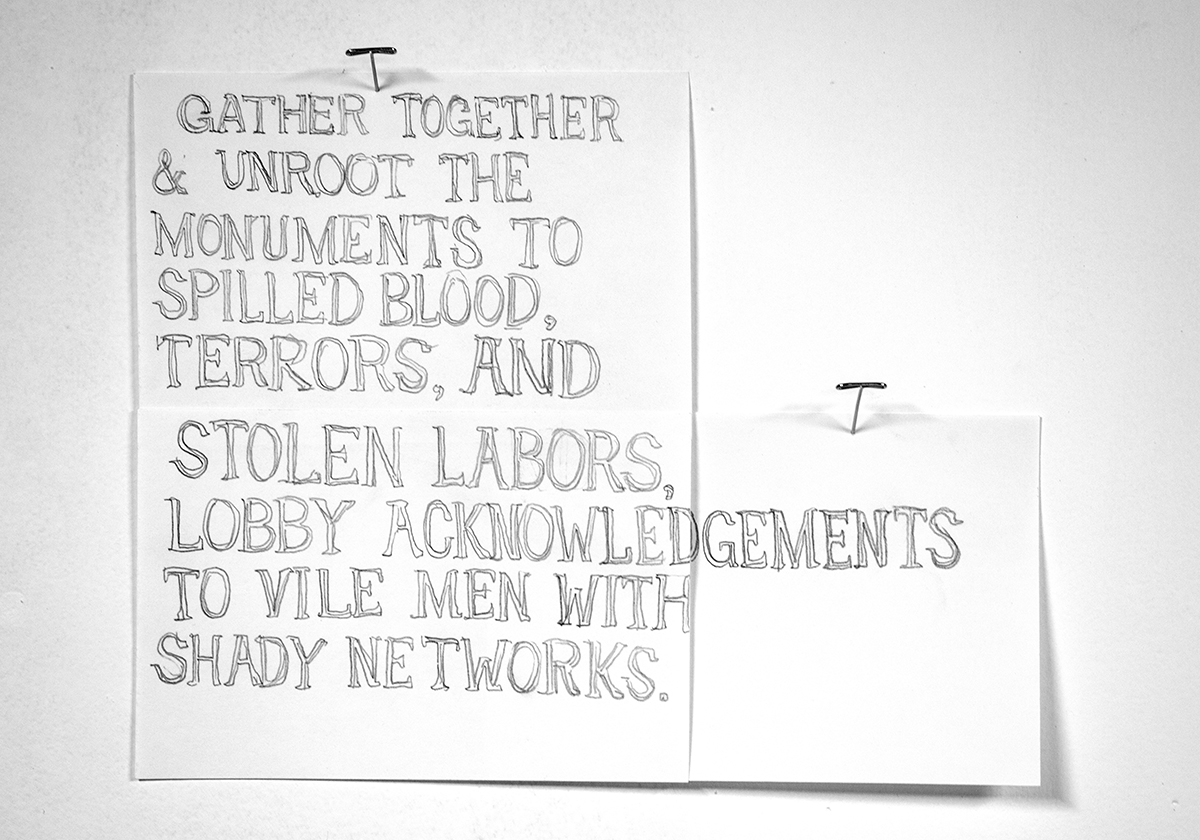 handwritten note on two pinned cards reading: "Gather together & unroot the monuments to spilled blood, terrors, and stolen labors, lobby acknowledgements to vile men with shady networks."